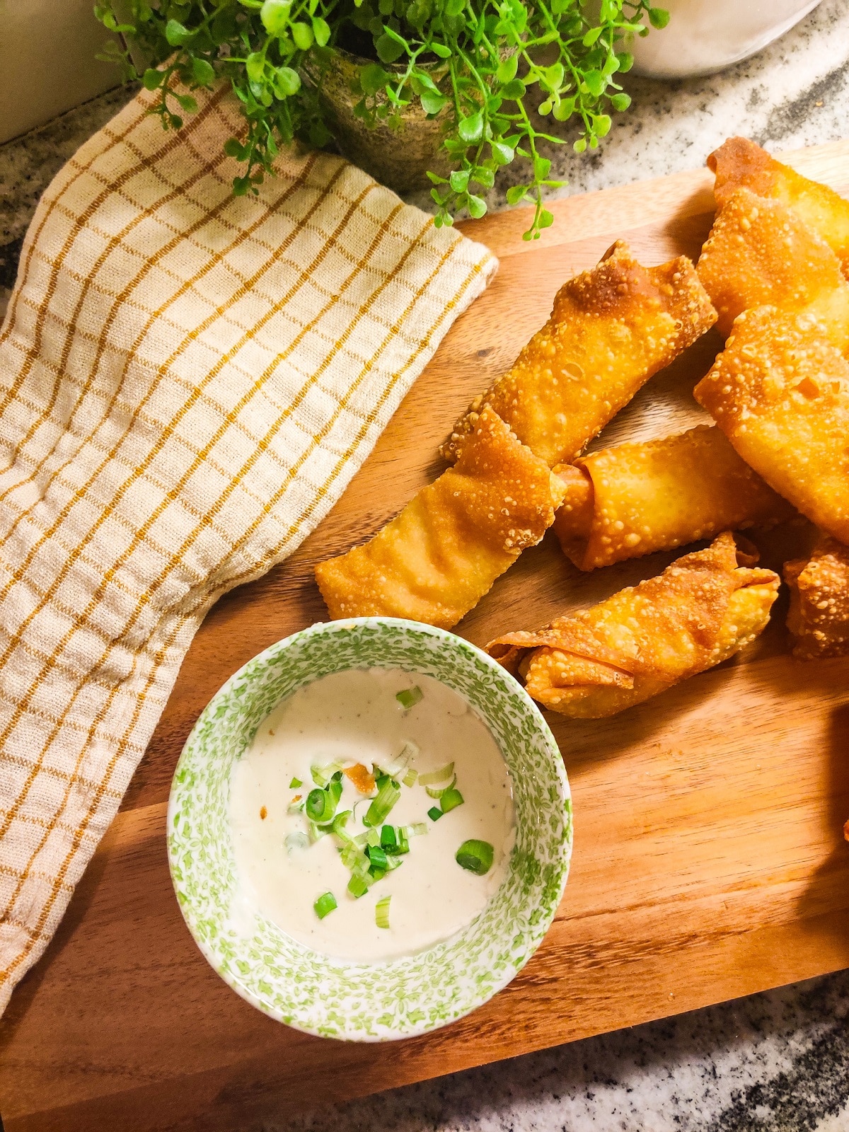 Buffalo Chicken Egg Rolls on A Cutting Board