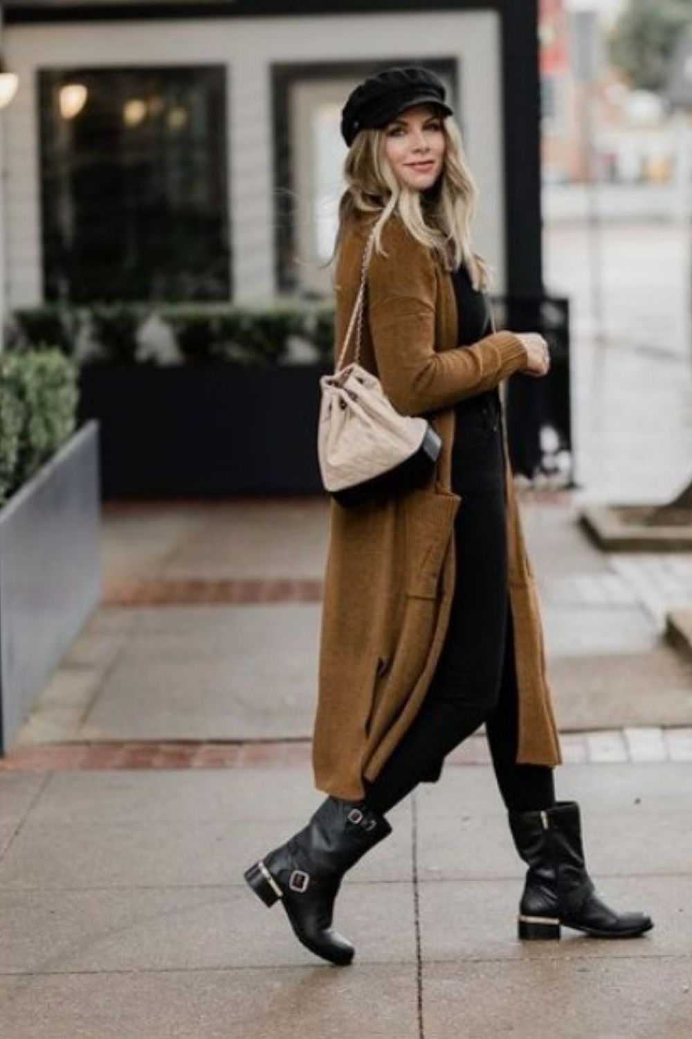 This picture is of a woman wearing moto boots, that are really cute. 